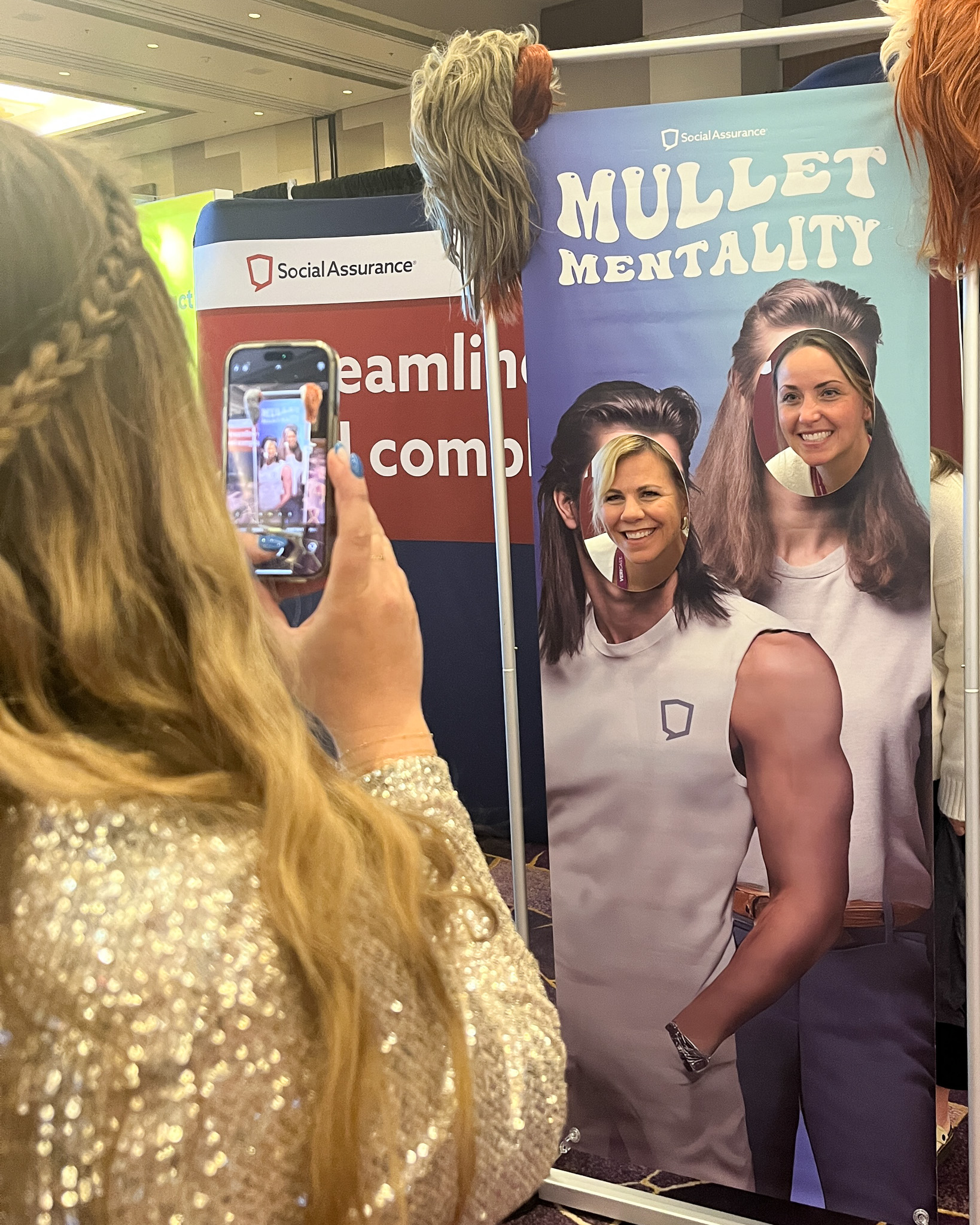 Jordyn photographing a couple of Financial Brand attendees.